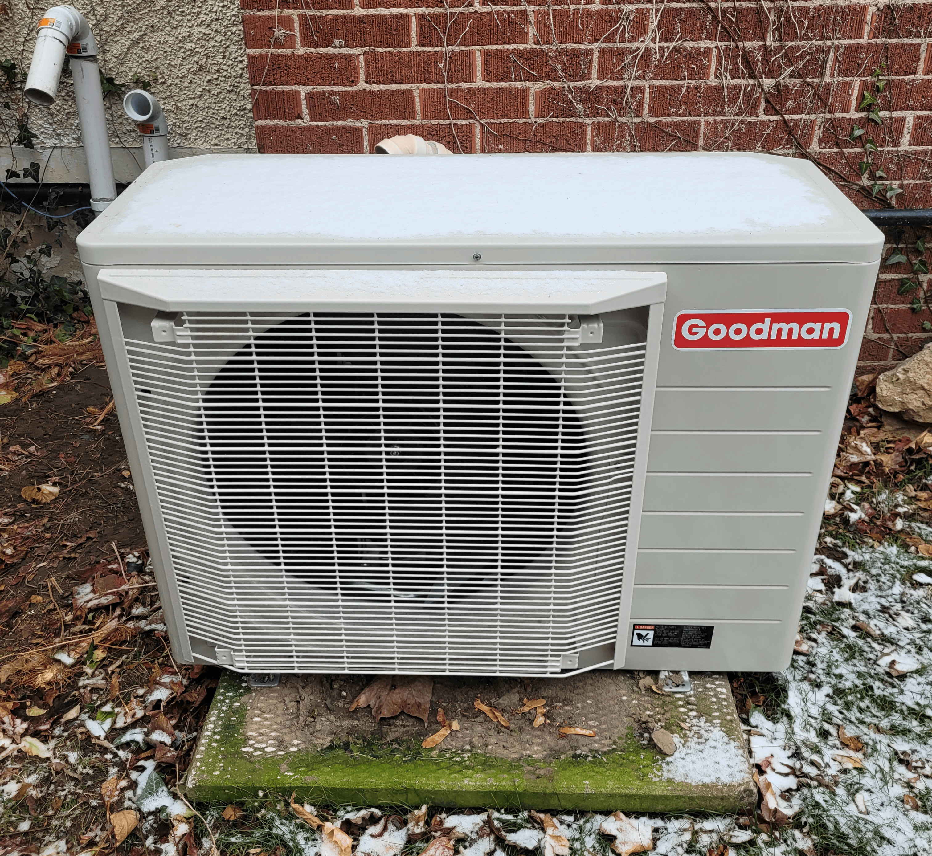 20241204_115833 Outdoor Goodman air conditioning unit on ground.